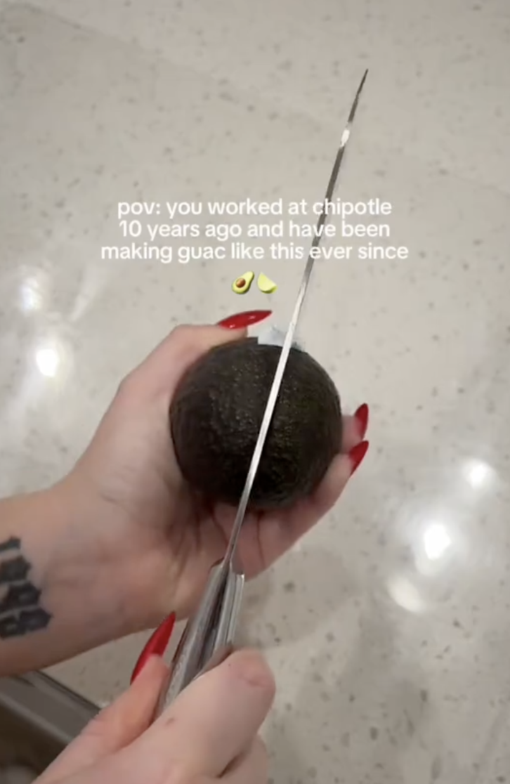 woman cutting up an avocado