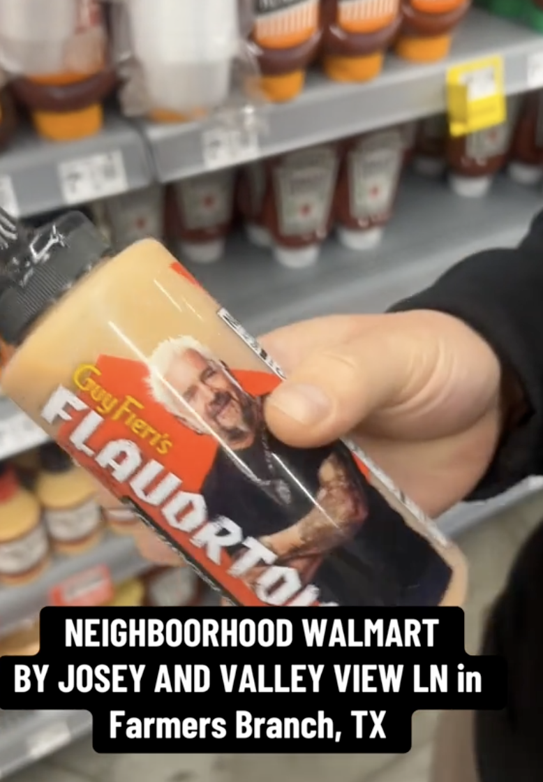 man holding sauce bottle