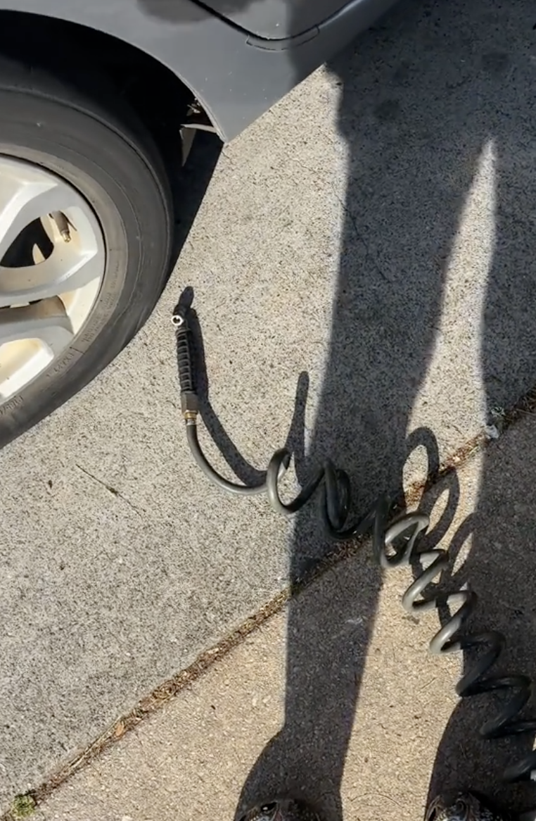 air hose next to a car tire
