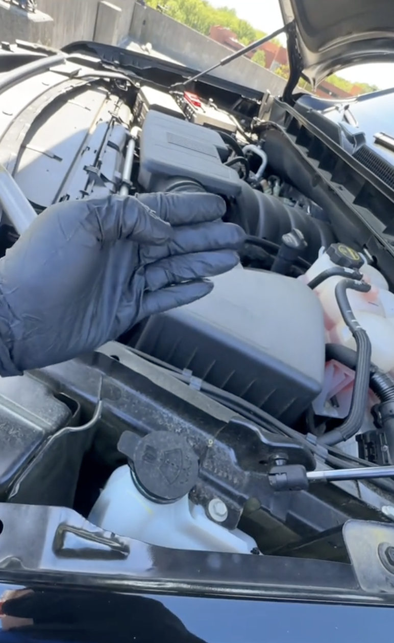 person looking at an engine