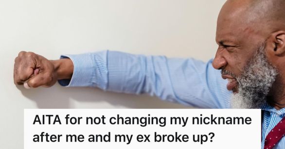 Man scowling and pounding fist on wall