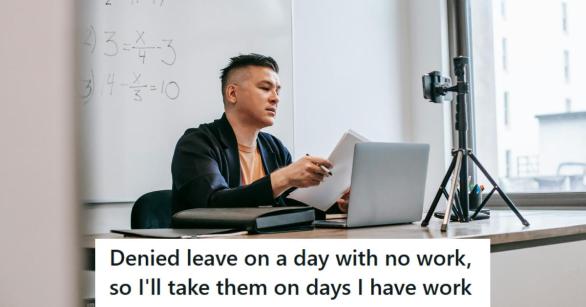 High School teacher looking over lesson plans at his desk