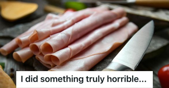Folded slices of ham on a wooden board and a knife