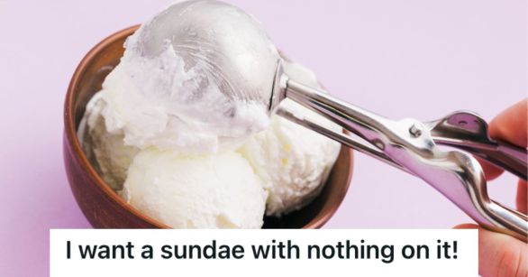A person's hand scooping vanilla ice cream onto a bowl