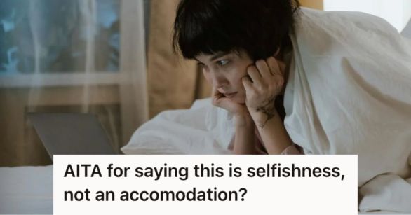 Woman looking at her laptop while in bed