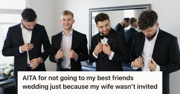 Four groomsmen wearing black suits and getting ready for a wedding