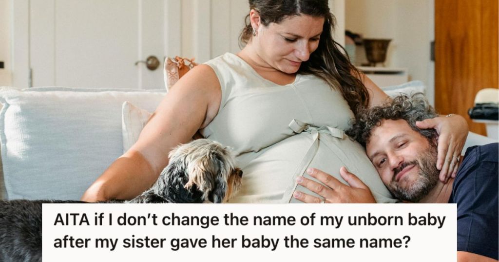 Man tuching his wife's baby bump while a dog sits next to them on the couch