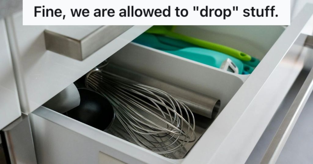 An open cutlery drawer with utensils, knives, and other kitchen accessories