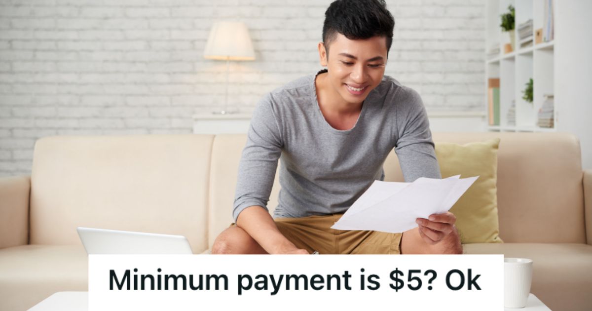 Man looking at a paper and smiling