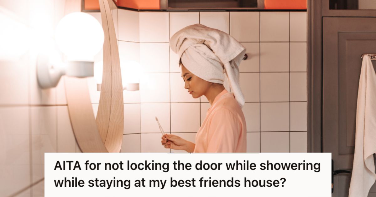 Woman in a bathroom brushing her teeth in the bathroom