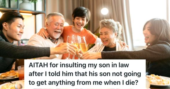 Happy family having dinner and clinking their glasses