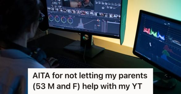 Man editing a video using two computers