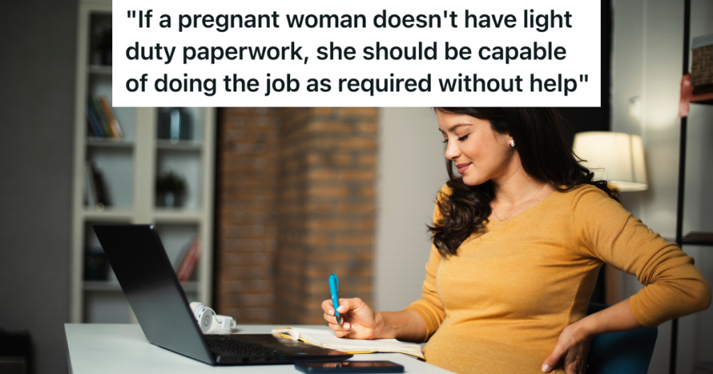 pregnant woman sitting at a desk