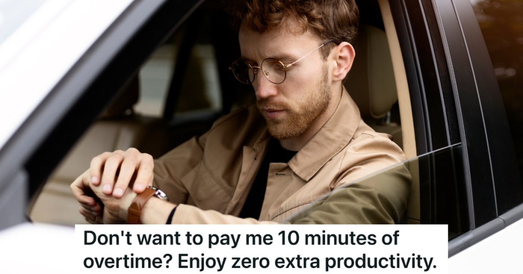 man sitting in his car looking at his watch