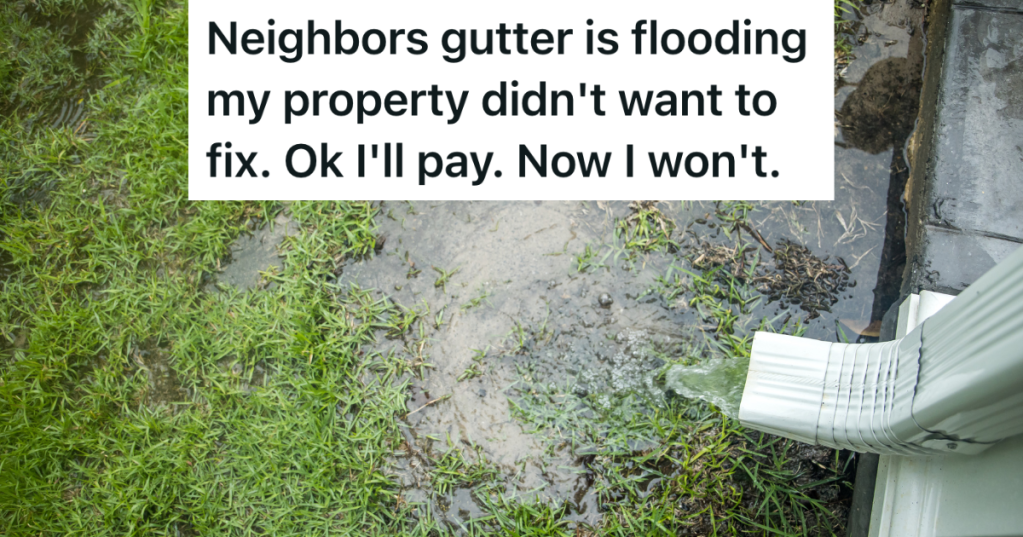 water pouring out of a gutter drain spout and flooding the yard