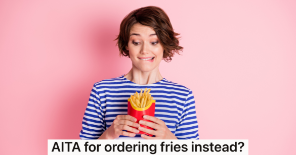 woman biting her lip while looking at fast food french fries