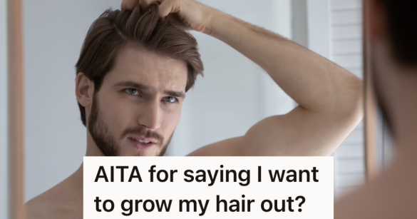 man looking at his hair in the mirror