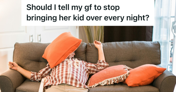 man exhausted on the couch covered in pillows