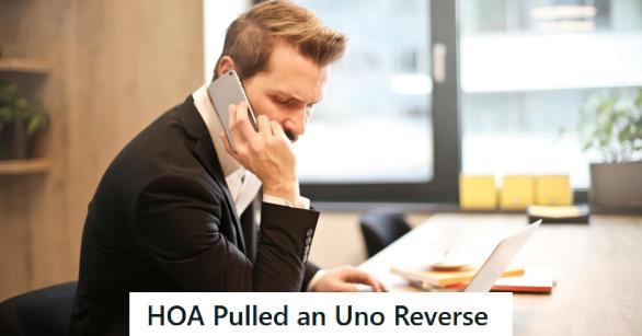 Door to door salesman in suit on the phone to HOA president