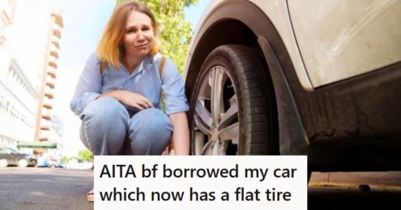 Woman working on a flat tire