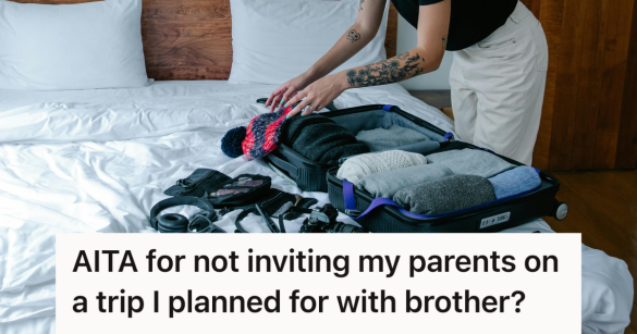 person packing a suitcase in their bedroom