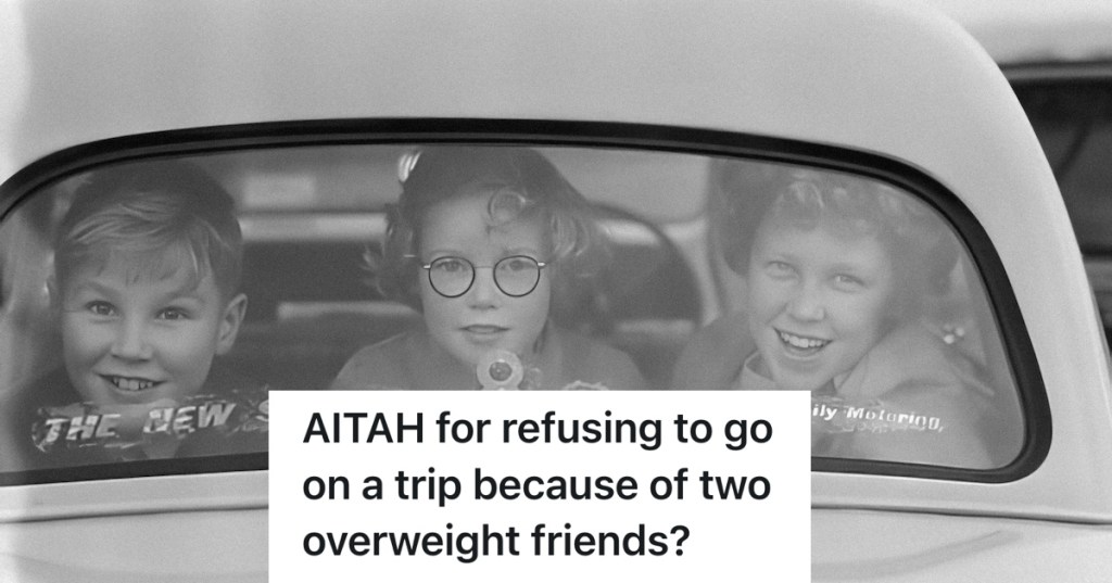 three ladies looking out the rear window of a car