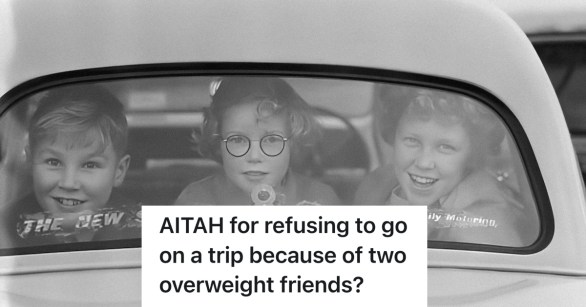 three ladies looking out the rear window of a car