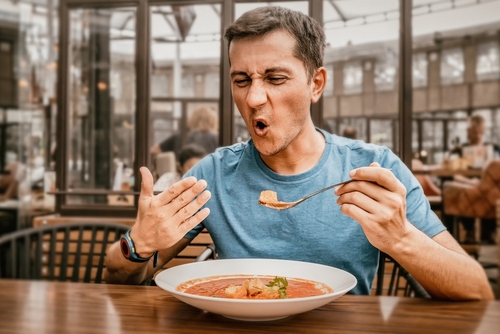 Man eating spicy food