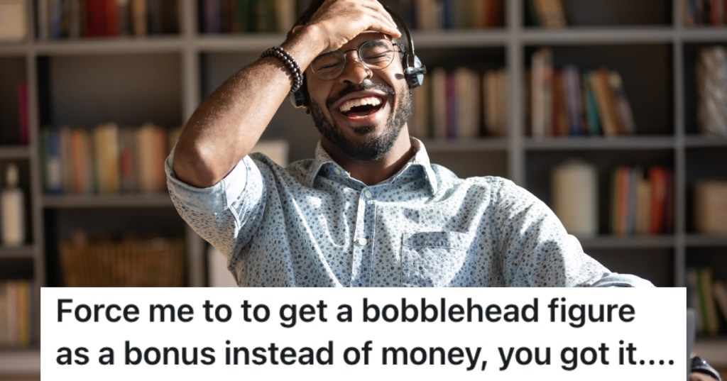 man laughing at his computer