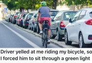 A Rude Driver Messed With A Cyclist, So He Made Sure He Had To Sit Through A Whole Green Light Cycle