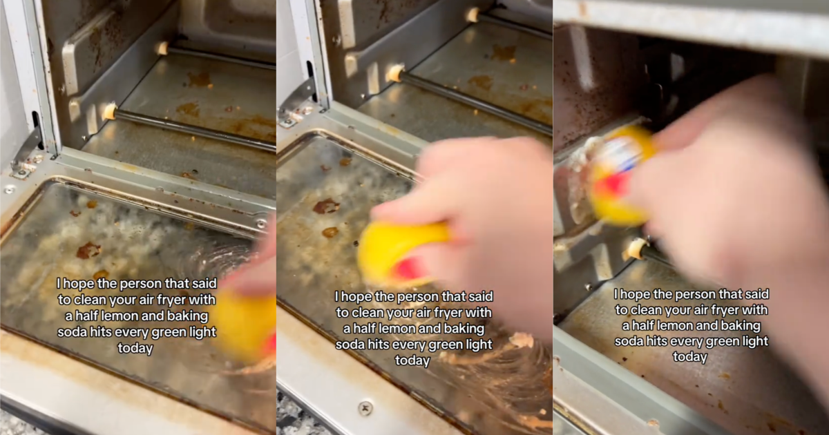 woman cleaning an air fryer