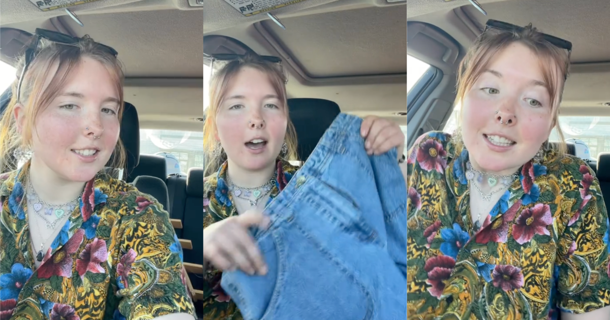 woman holding a pair of jeans