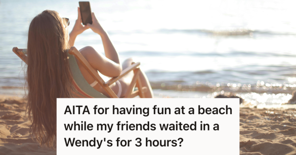 woman on her phone at the beach