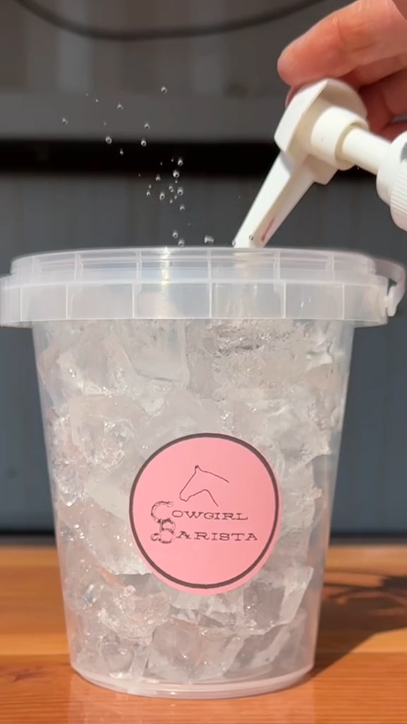 Cowgirl Barista making a bucket of iced coffee