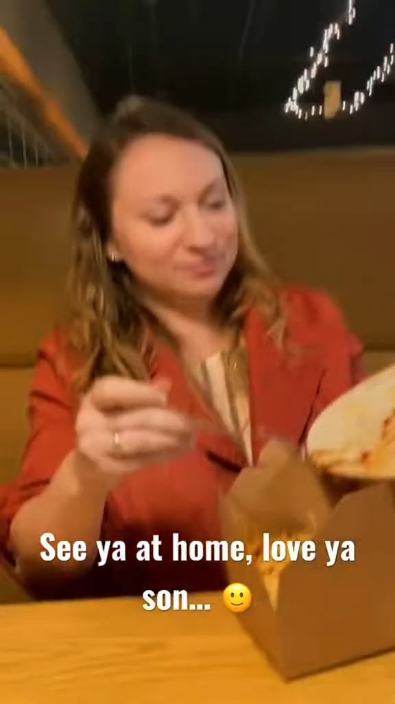 A couple talking to their waiter at a restaurant