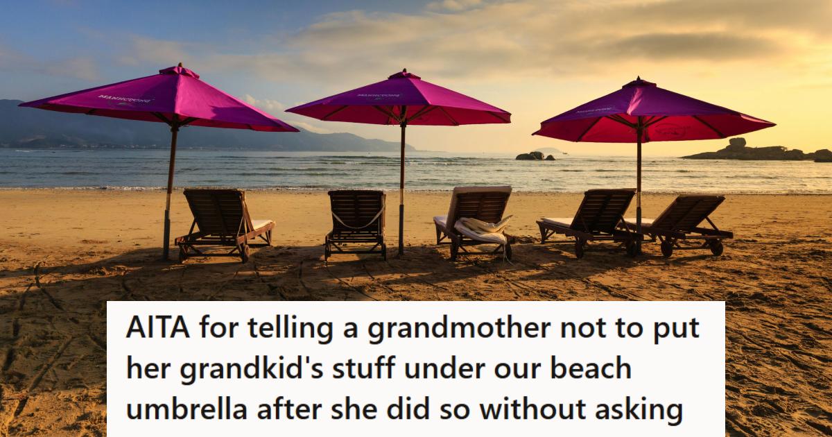 Pink umbrellas set up with chairs on the beach