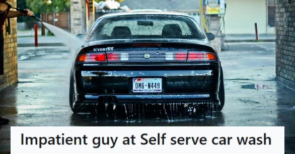 Nice older black car getting hand-washed at a car wash
