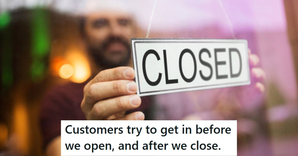 Man putting up closed sign