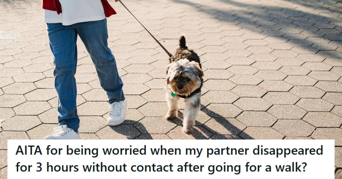 Man walking small dog down the sidewalk on a leash