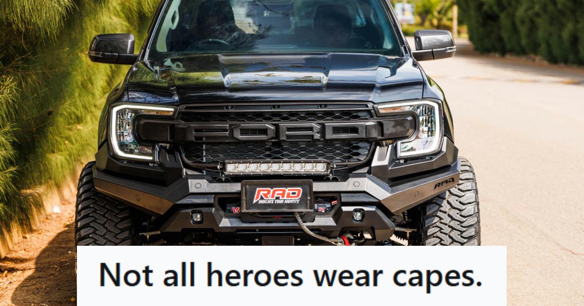 Black Ford F-150 Raptor parked on the road