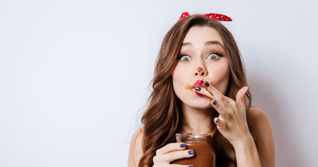 Woman eating jar of soil