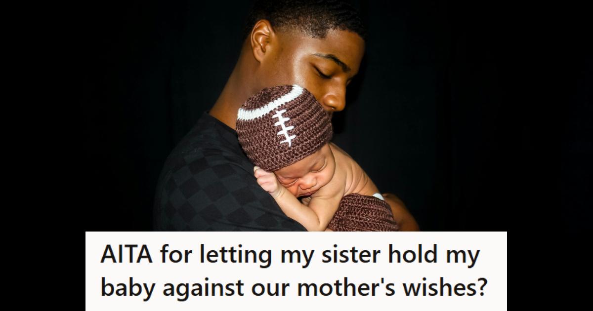 New father holding his newborn baby in his arms