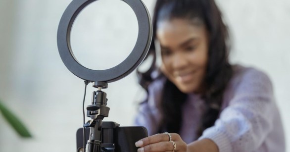 An influencer preparing her camera