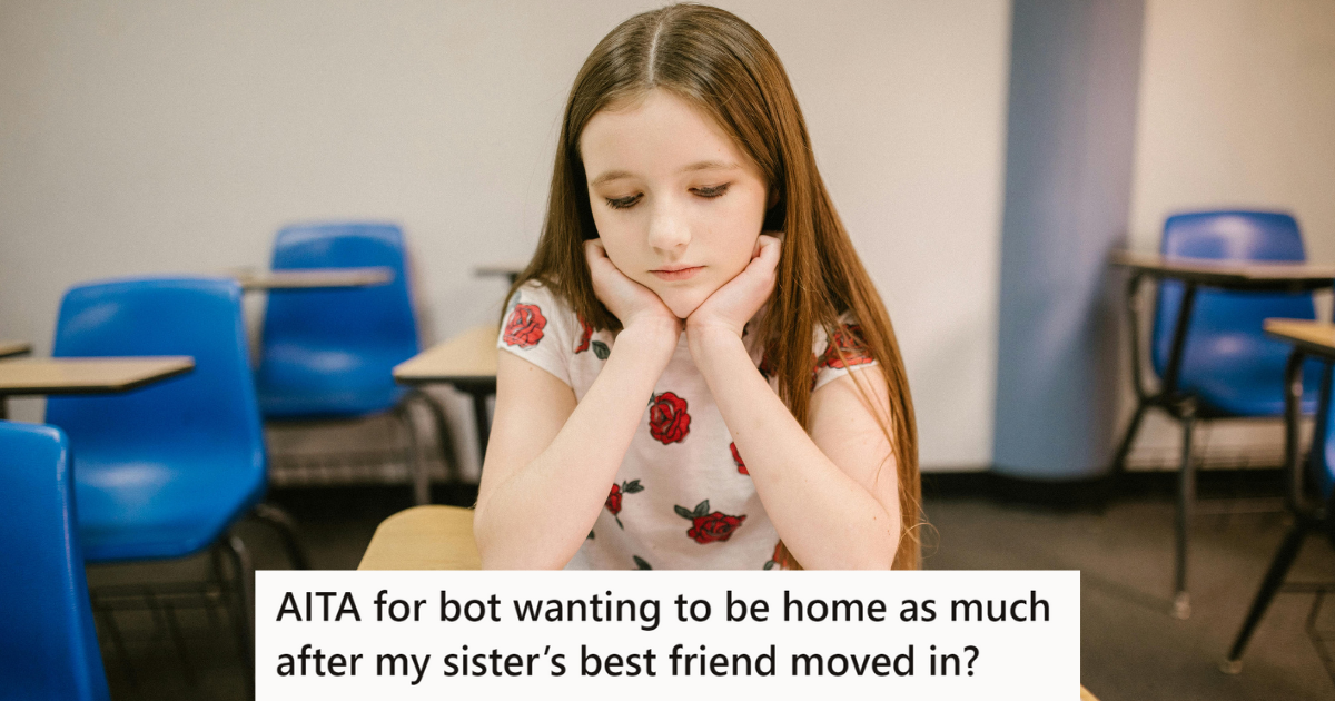 Sad girl sitting on a school desk