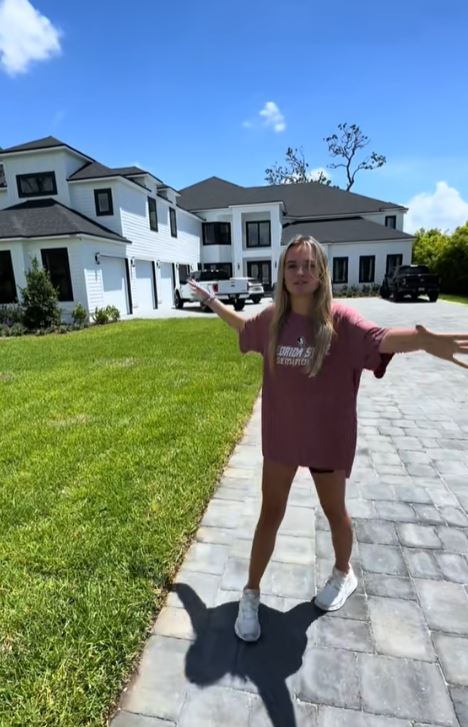 TikToker giving a tour of her huge house.