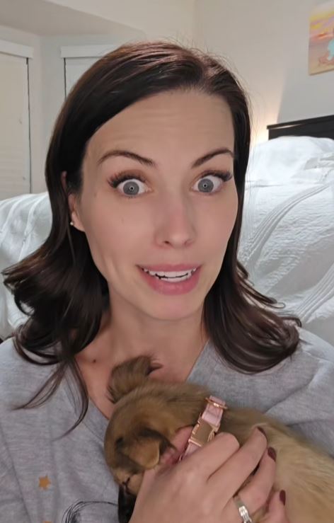 Woman holding a puppy