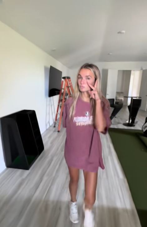 TikToker giving a tour of her huge house.