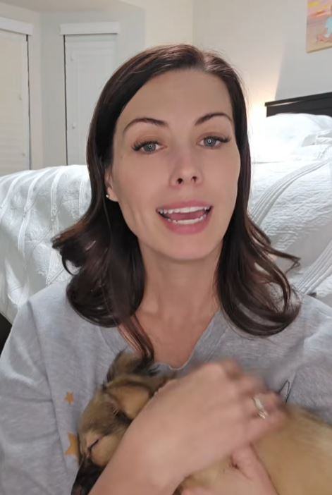 Woman holding a puppy