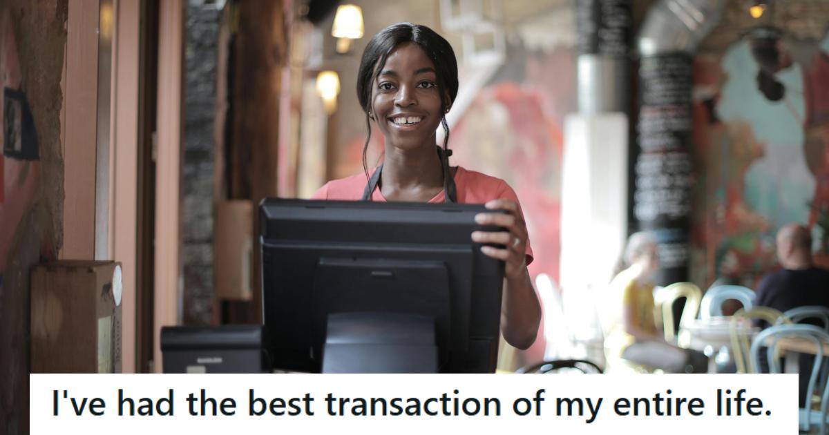 Cashier standing at the register with a big smile on her face