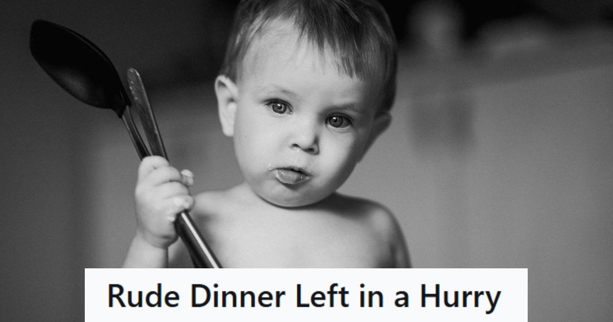 Black and white photo of a baby holding spoons in his hand